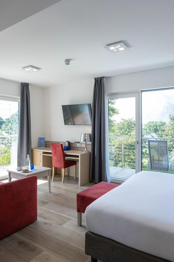 Hotel Bellariva 4 stars Riva del Garda – Lakefront View & Adults-Friendly Hospitality Bellariva srl | Deluxe Triple Room with lake view and double balcony