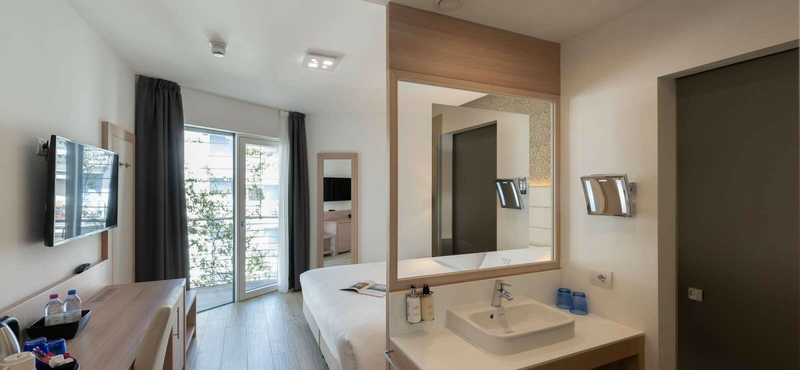 Comfort Room with balcony and partial lake view